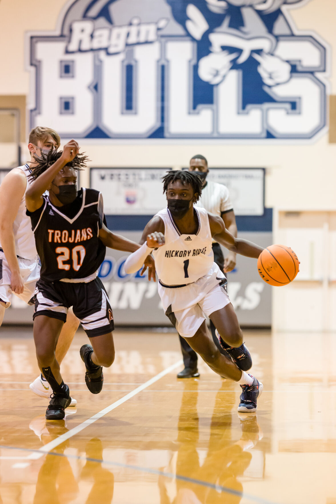 Boys Basketball: Hickory Ridge RaginÕ Bulls defeated the Northwest Cabarrus Trojans 64-56.